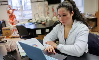 A student reviews information in an anatomy class.
