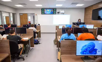 Dona Siregar instructs students in a corporate finance class.