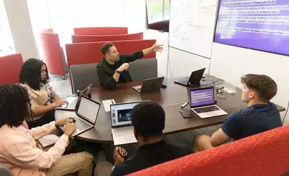 Students learning hands-on as they prep for the pitch competition.