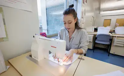 Learning sewing during a textiles and fashion class