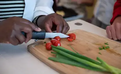 Prepping vegetables as part of a cooking class