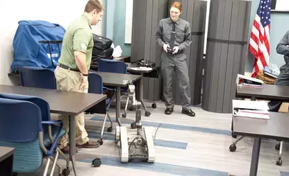 Cadets work with a robot at the Otsego County Law Enforcement Academy.