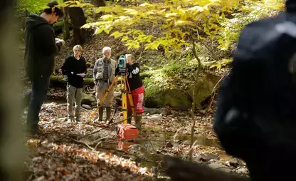 Students learn geoscience mapping techniques in the field.