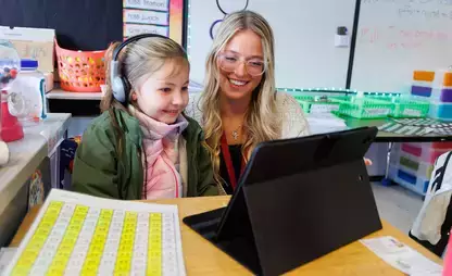 Student teacher working on-on-one with a young child.