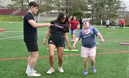 Exercise Science students work with participants of the Adaptive Sports Field Day