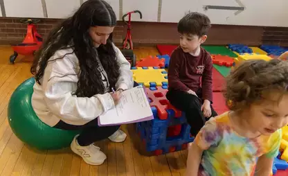 Exercise Science student working with kids in the Bugbee Children's Center