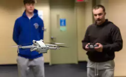 Students practice with a drone during UAV operations class