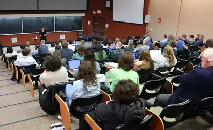 Large group of people seated in a lecture hall