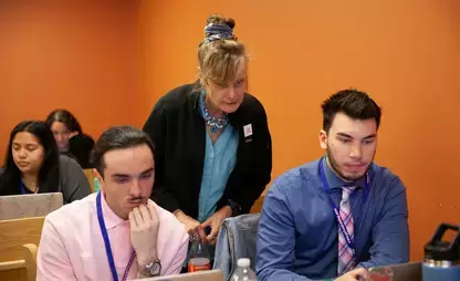 Dr. Leanne Avery works with senior Elementary Education majors.