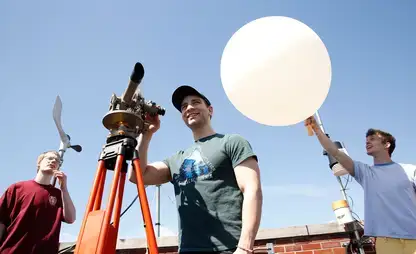 Meteorology students practice launching a weather balloon