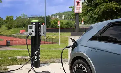 EV Charger in use near the athletic track