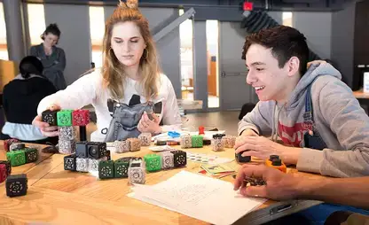Students manipulate blocks in an activity in the Science Discovery Center