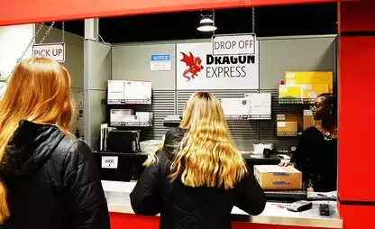 Students at the Dragon Express counter, where students can send and received mail and packages