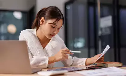 Individual reviews information on a tablet device