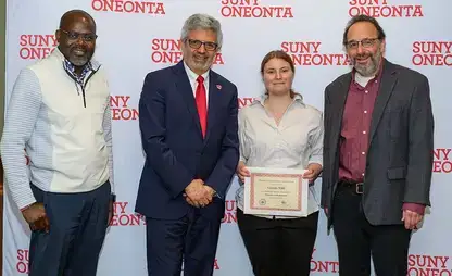 Dr. Maurice Odago, President Alberto Cardelle, Gianna Vitti, and Dr. William Vining at the 2025 Academic Achievement awards ceremony