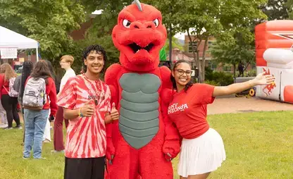 Students posing with Red during Red Day