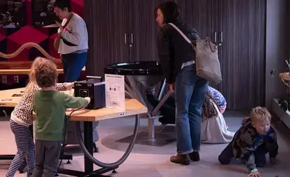 Young visitors interact with an exhibit at the Science Discovery Center