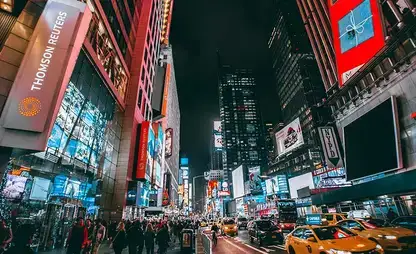 Nighttime view of neon lights and billboards in Times Square