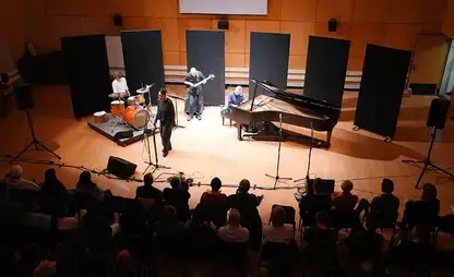 Artist in residence Lisa Marie Simmons performs on stage.