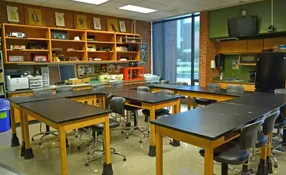 Lab-style classroom with shelving and tools for designing props and costumes.