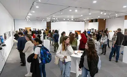Students and faculty mingle in one of the art galleries.