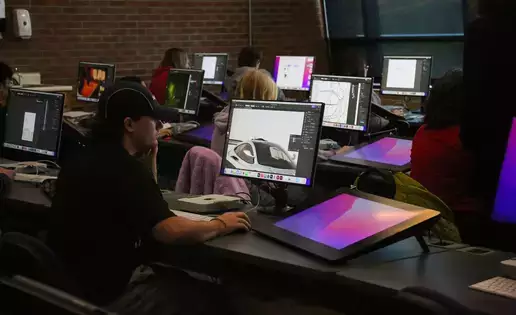 Students utilizing digital tools as part of their graphics class.