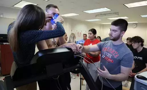 Prepping a subject in the Exercise Testing and Prescription Lab