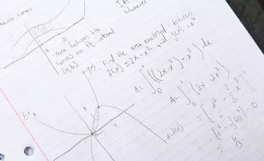 Calculus notes showing graphing and functions.