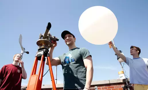 Meteorology students practice launching a weather balloon