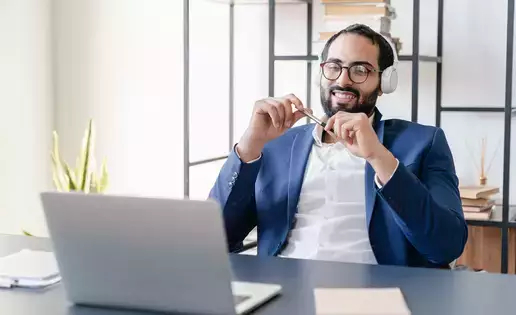 Business manager conducting an online call over a laptop