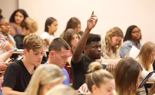 Students interact with a lecturer during Communication Studies class