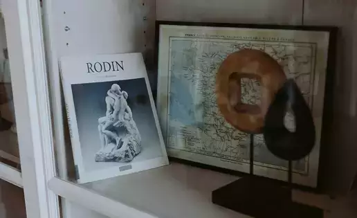 A simple display of French-related artifacts sits on a shelf