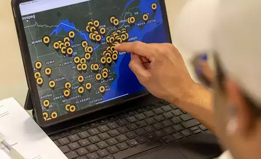 A student uses modern technology to review geographic information systems
