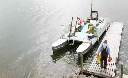 Preparing for a SCUBA dive on Otsego Lake at the Biological Field Station near Cooperstown