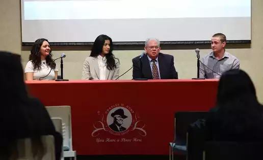A panel of four individuals discusses political science