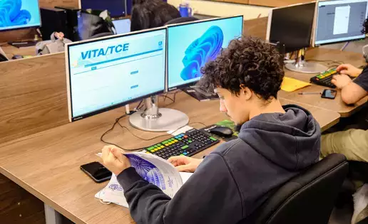 A student review information in the Volunteer Income Tax Assistance course