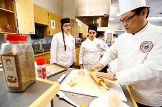 Chef teaching students.