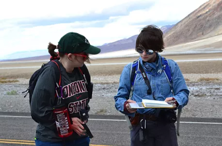 Students looking at a map in the Bad Lands