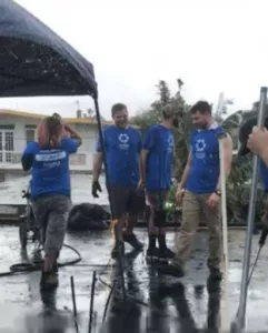 Student volunteers fixing a roof in Puerto Rico.