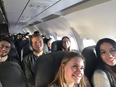Students and faculty riding the plane to Puerto Rico