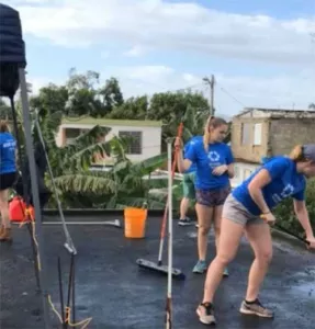 Student volunteers fixing a roof in Puerto Rico.