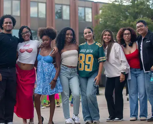 A group of happy students pose for a photo during the Parade of Nations celebration.