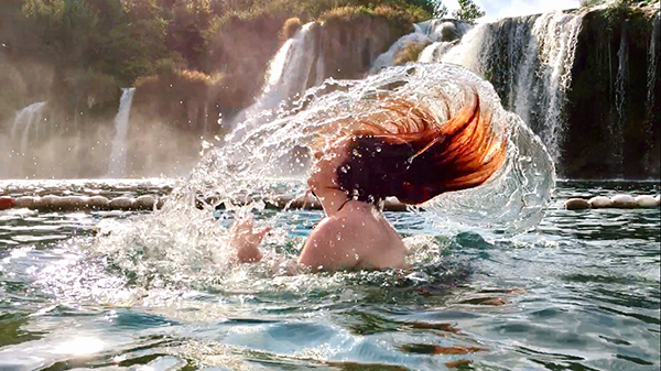 Student in front of waterfall in Croatia