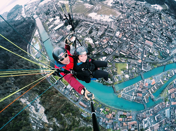 Student paragliding above the Swiss Alps