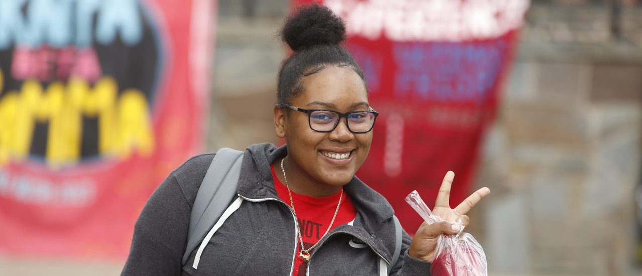 Girl giving peace sign